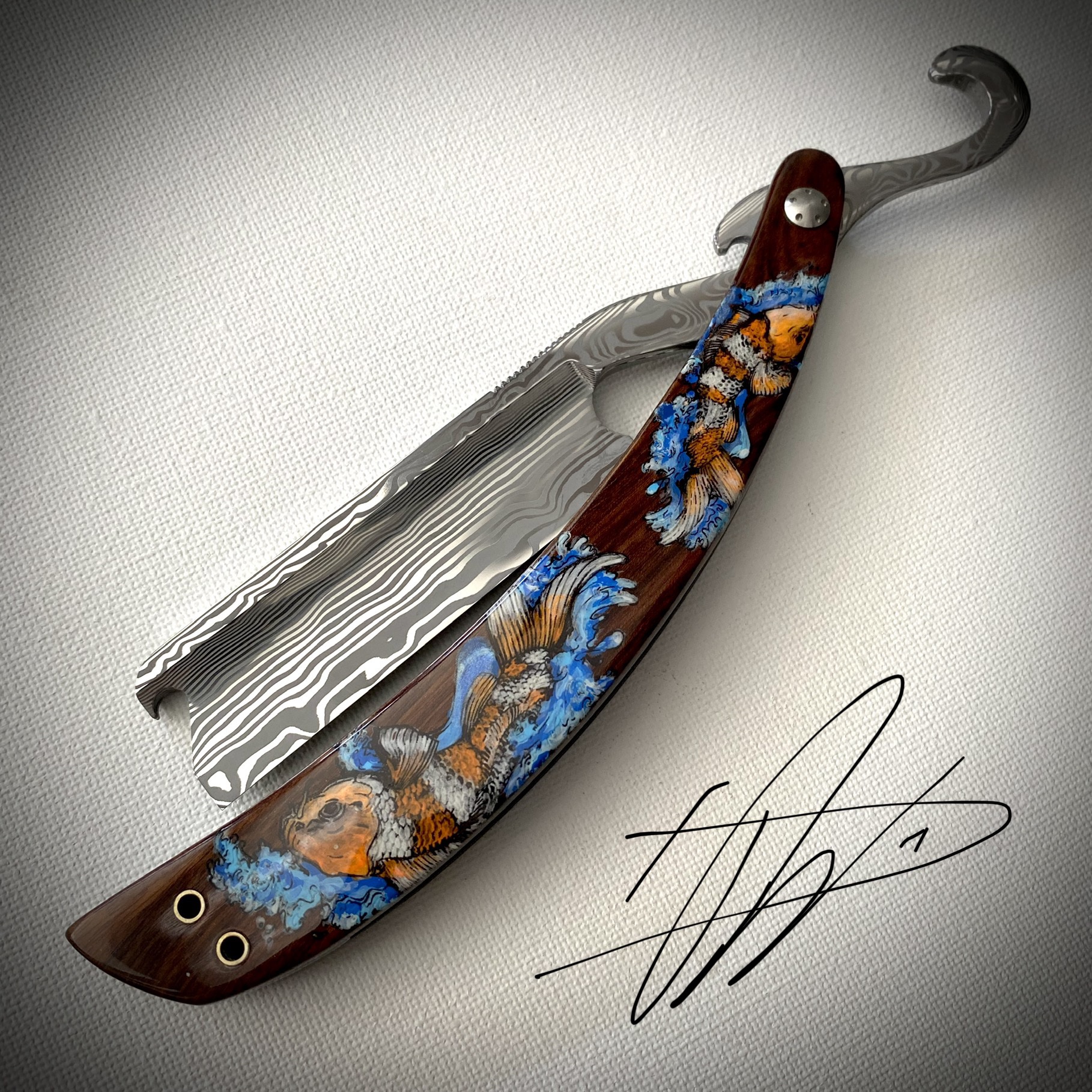 Woolfblades 325 Custom Made in a Vinland Damasteel  the scales are made in solid wood with carbon fibre inlays the designs are hand painted