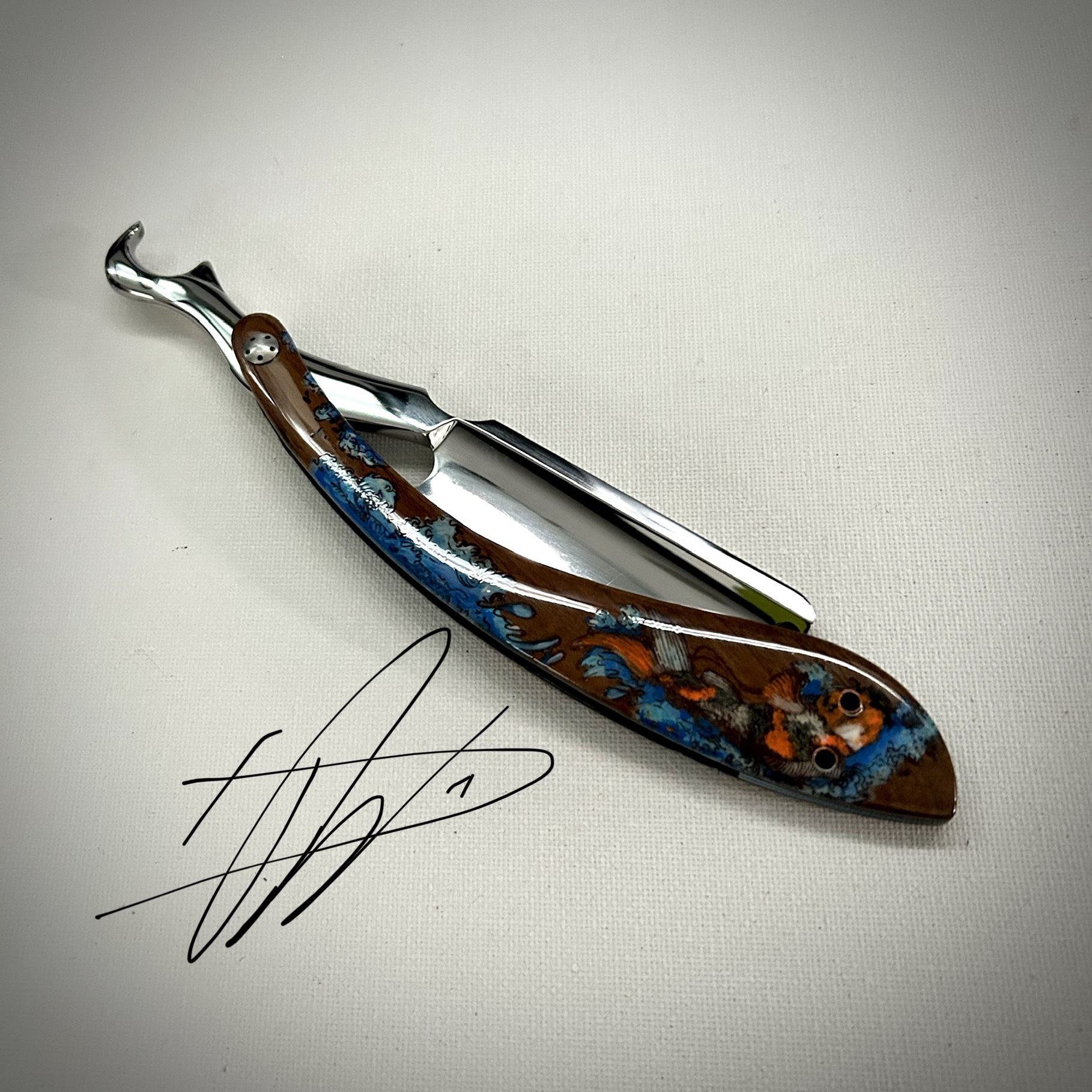 Woolfblades 347 Custom Made in a RWL34 razor ,And the scales are made in a solid wood with carbon fibre inlays the koi design is hand painted