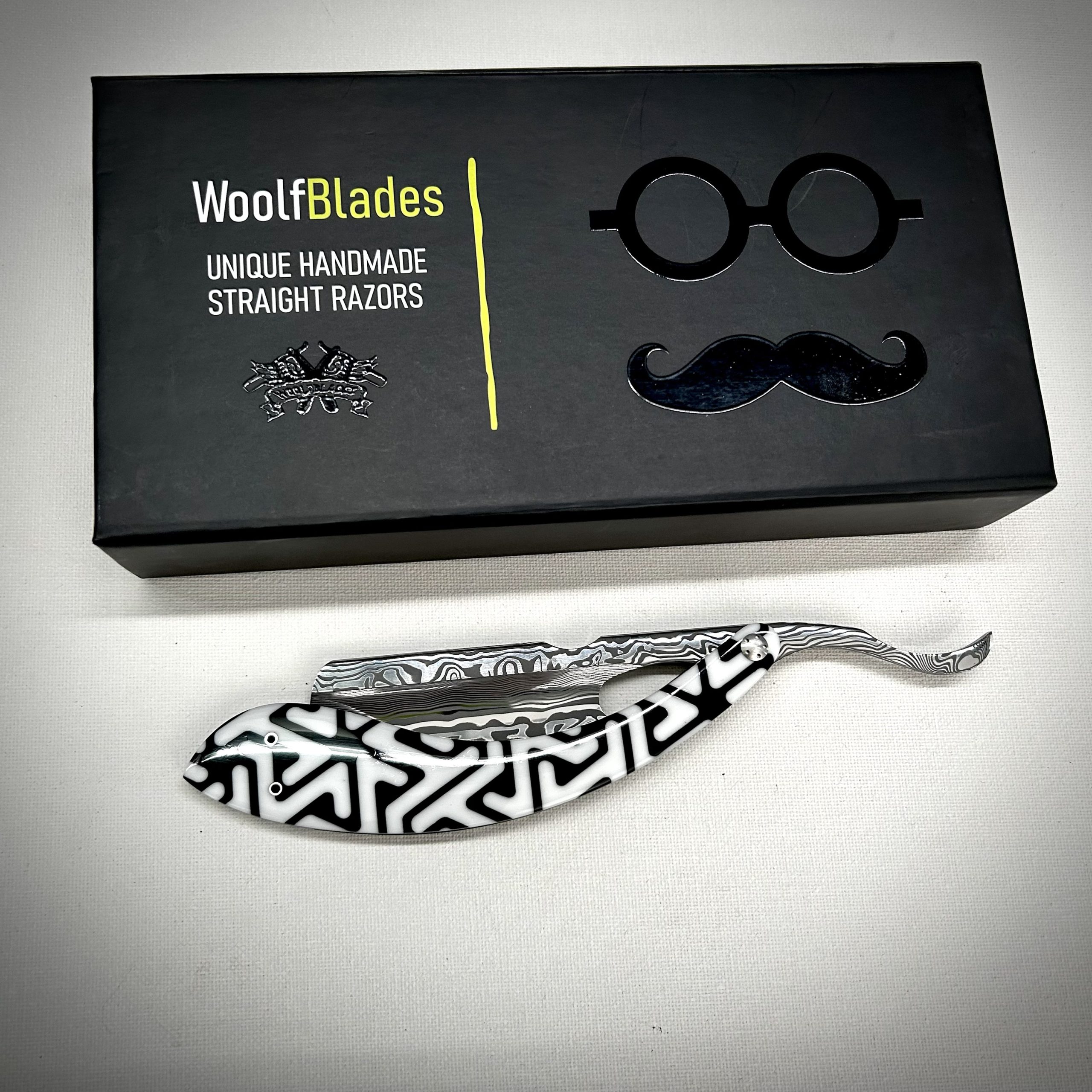 Woolfblades 354 Custom Made in a Vinland Damasteel razor ,And the scales are made in a Voodoo resin with carbon fibre inlays